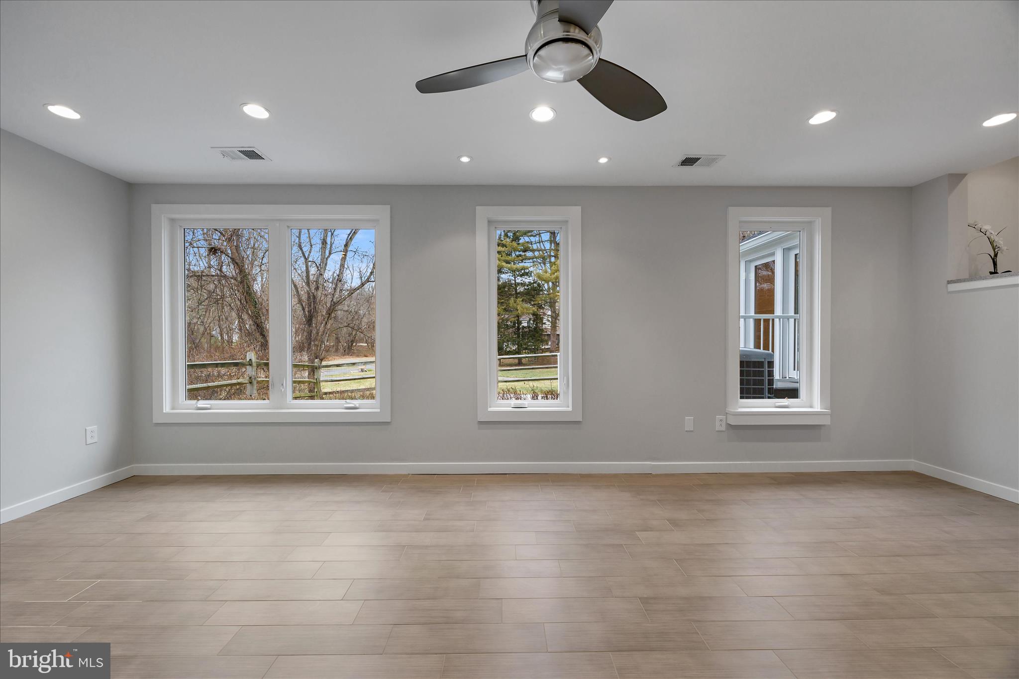 6278 Branch Beech Columbia, MD 21044 - Photo 25 of 57 a view of an empty room with a window and wooden floor