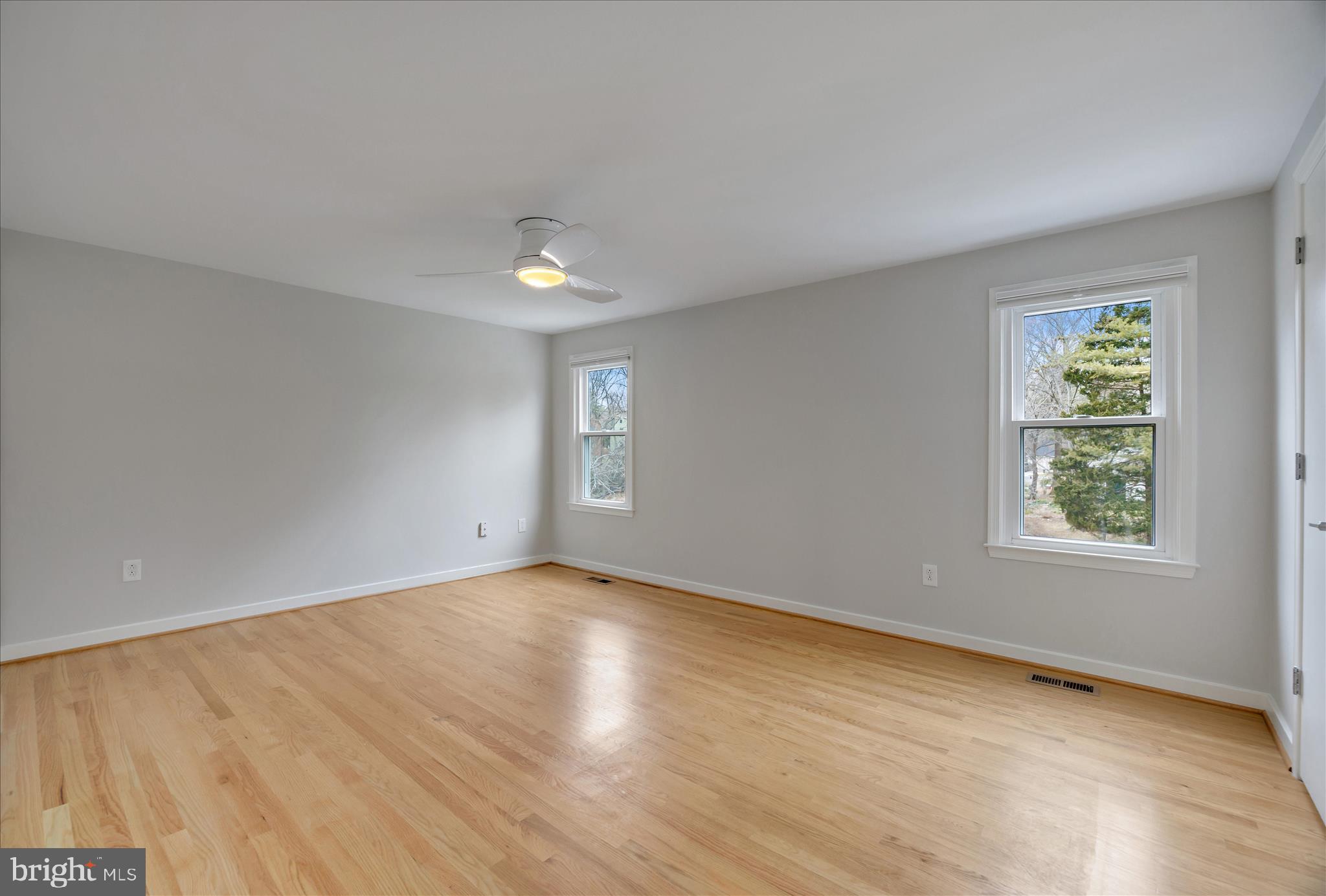 6278 Branch Beech Columbia, MD 21044 - Photo 29 of 57 an empty room with wooden floor and windows