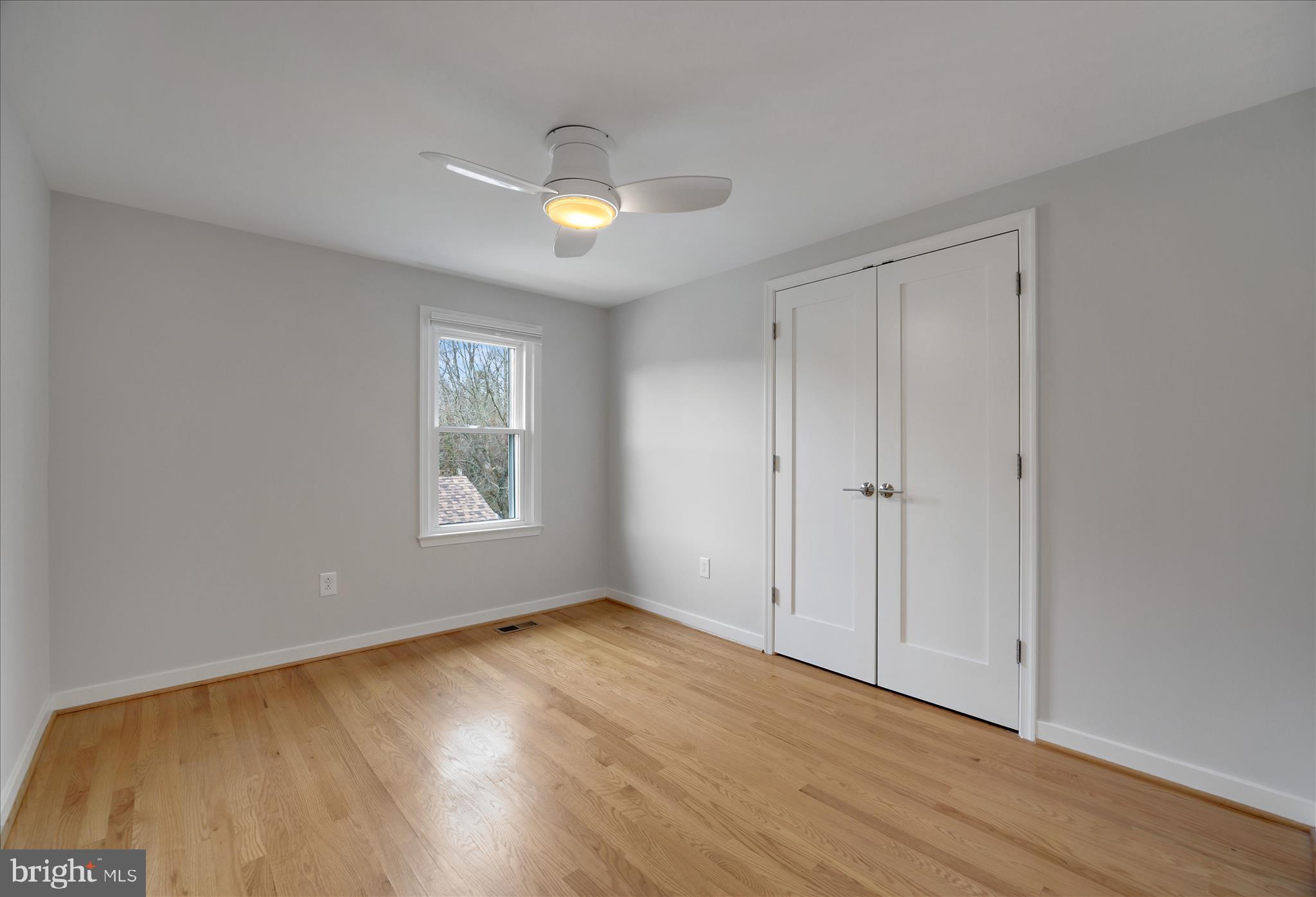 6278 Branch Beech Columbia, MD 21044 - Photo 42 of 57 a view of an empty room with wooden floor and a window