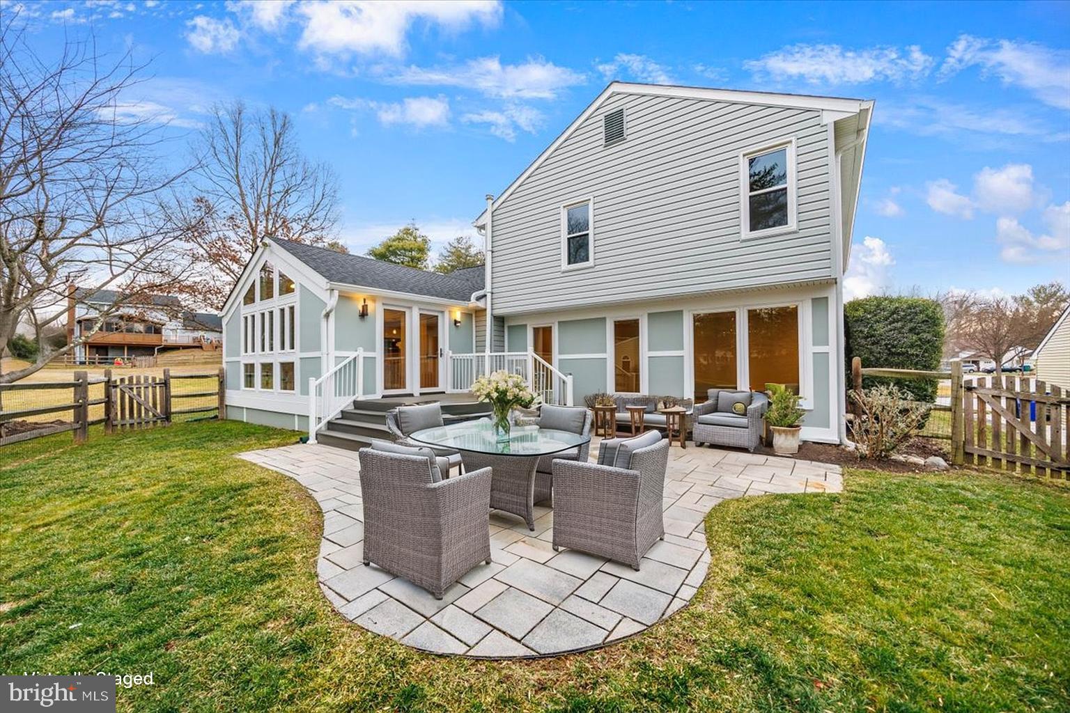 6278 Branch Beech Columbia, MD 21044 - Photo 50 of 57 a view of a house with backyard sitting area and garden