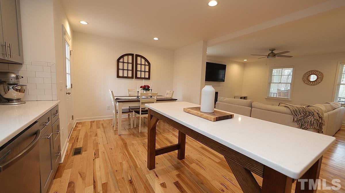 5000 West Pool Road Rougemont, NC 27572 - Photo 14 of 29 a view of a kitchen area with furniture and wooden floor