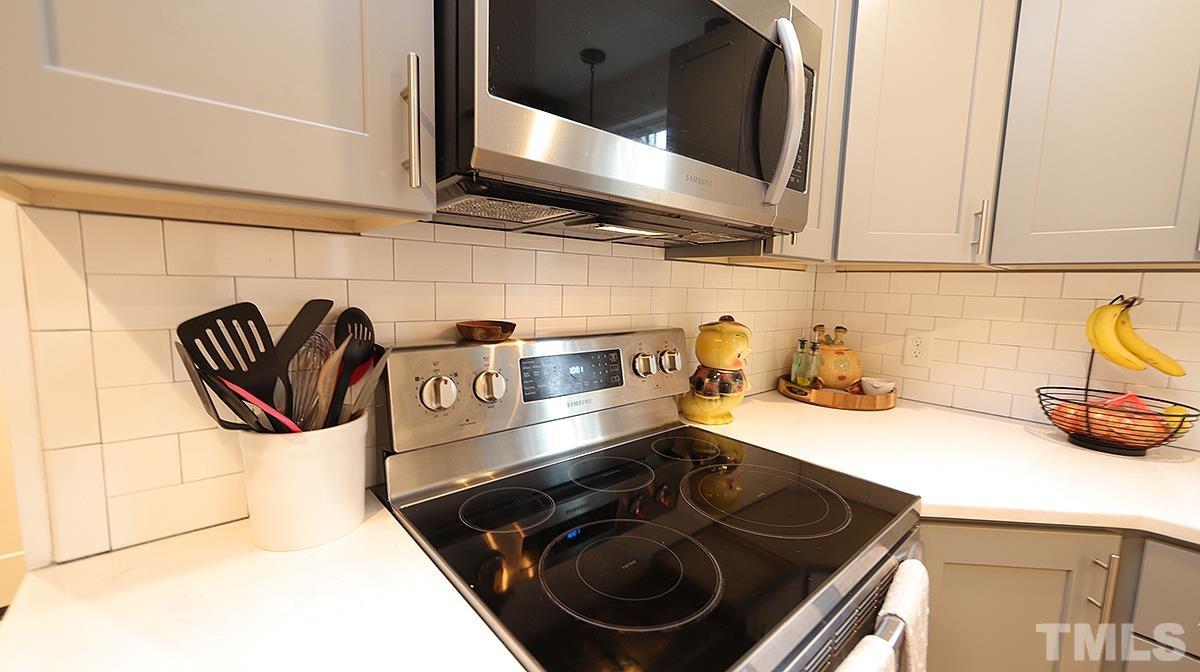 5000 West Pool Road Rougemont, NC 27572 - Photo 15 of 29 a kitchen with a stove and cabinets