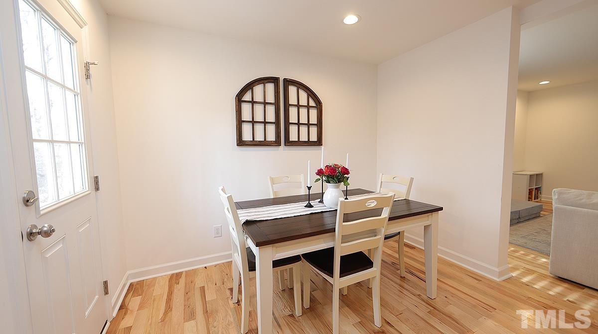 5000 West Pool Road Rougemont, NC 27572 - Photo 17 of 29 a view of a dining room with furniture and wooden floor