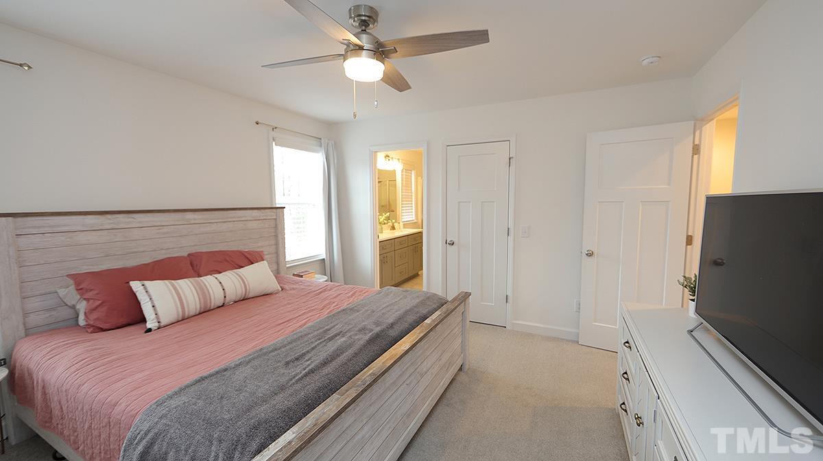 5000 West Pool Road Rougemont, NC 27572 - Photo 21 of 29 a bedroom with a bed and a flat screen tv