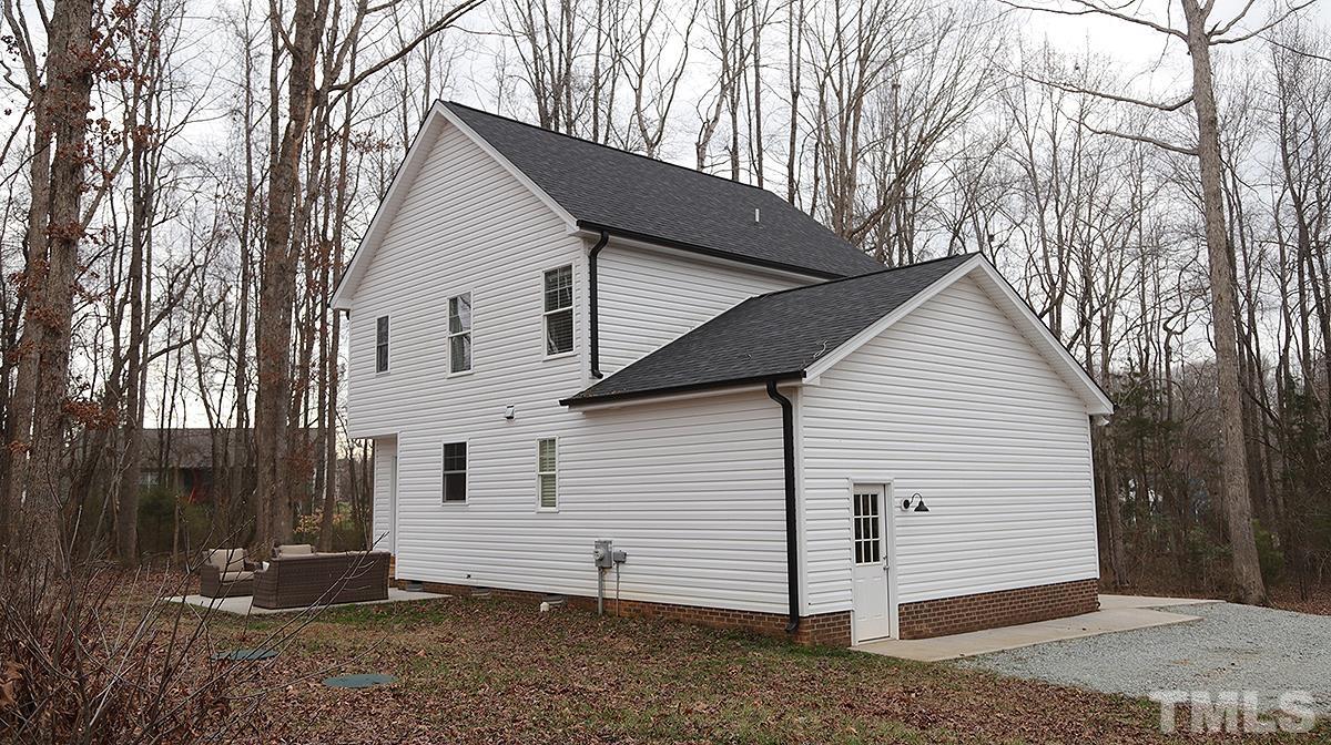 5000 West Pool Road Rougemont, NC 27572 - Photo 29 of 29 a view of a white house with a large tree