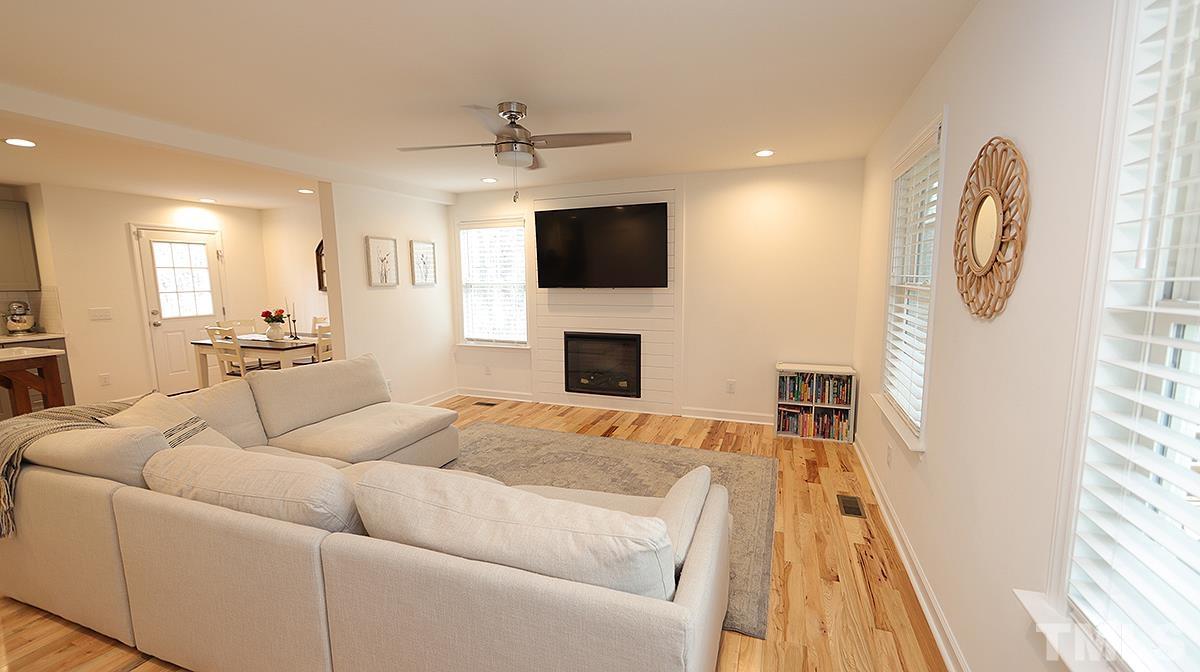 5000 West Pool Road Rougemont, NC 27572 - Photo 7 of 29 a living room with furniture and a flat screen tv