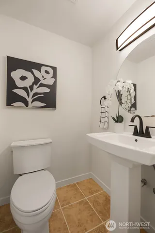 a kitchen with a refrigerator and a stove top oven