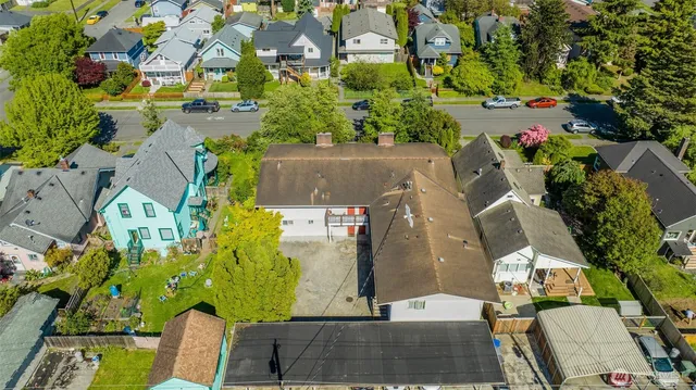an aerial view of a house with a yard and garden