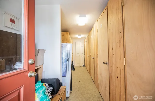 a view of a house with backyard and a tree