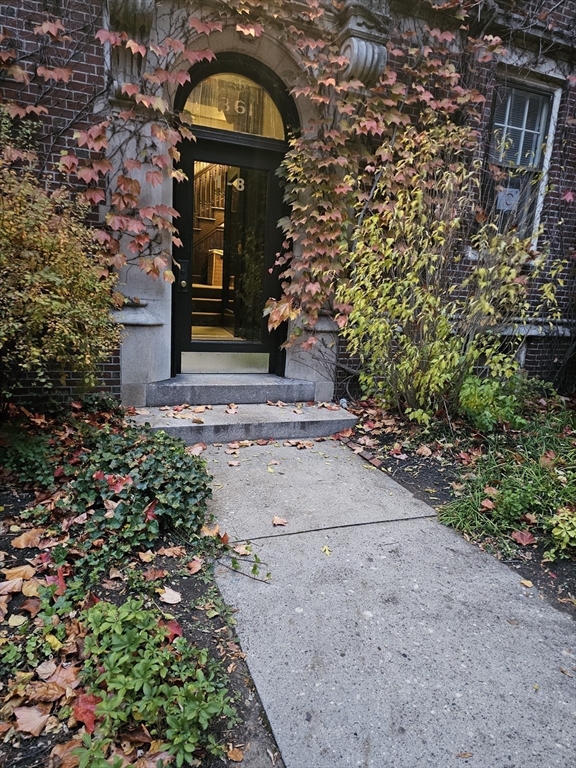 361 Harvard Street, Unit 2 Cambridge, MA 02138 - Photo 8 of 8 a front view of a house with garden