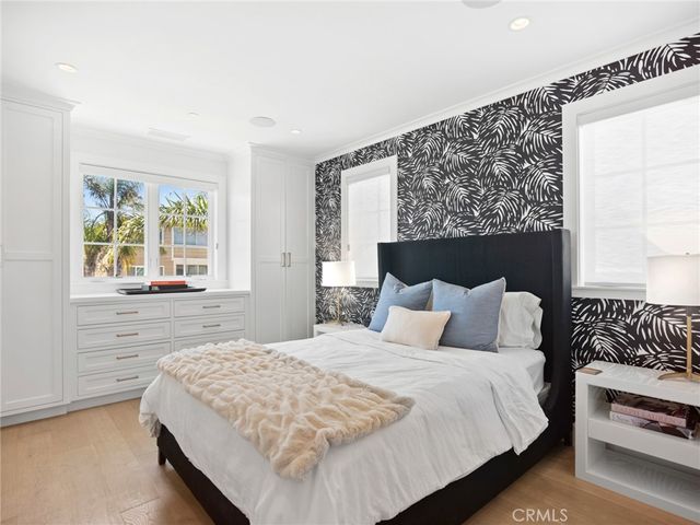 a kitchen with stainless steel appliances granite countertop a white cabinets and a stove