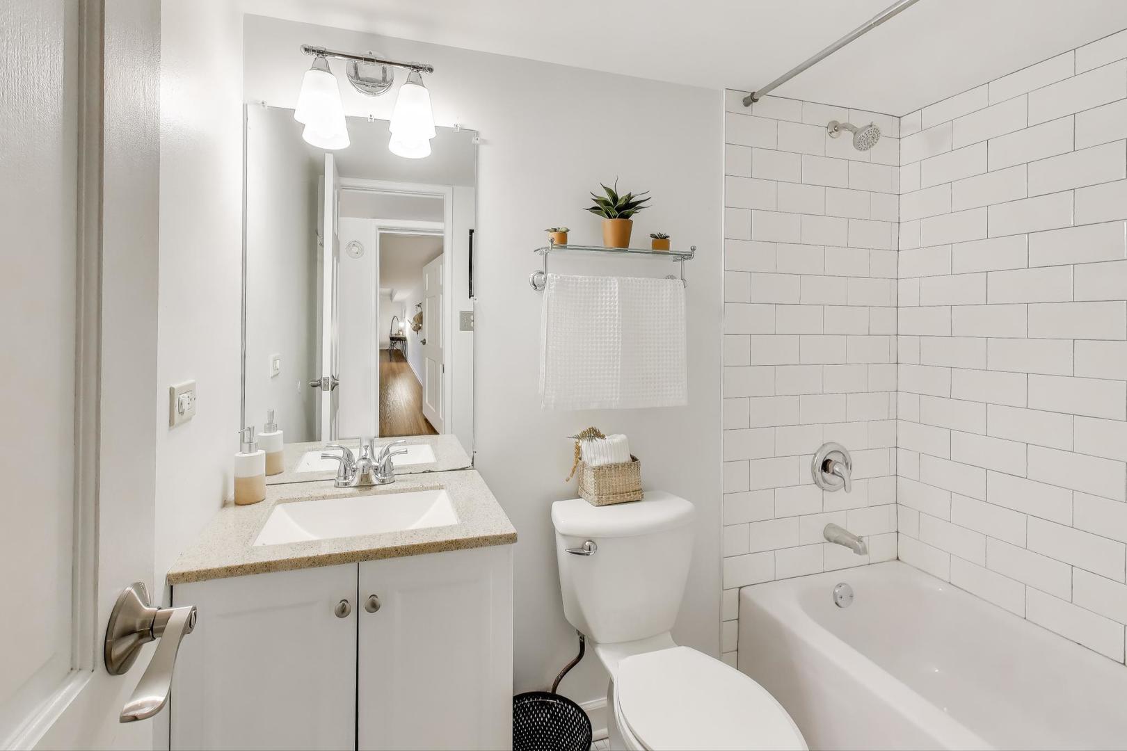 6443 Clarendon Hills Road, Unit 100D Willowbrook, IL 60527 - Photo 21 of 31 a bathroom with a sink toilet and shower