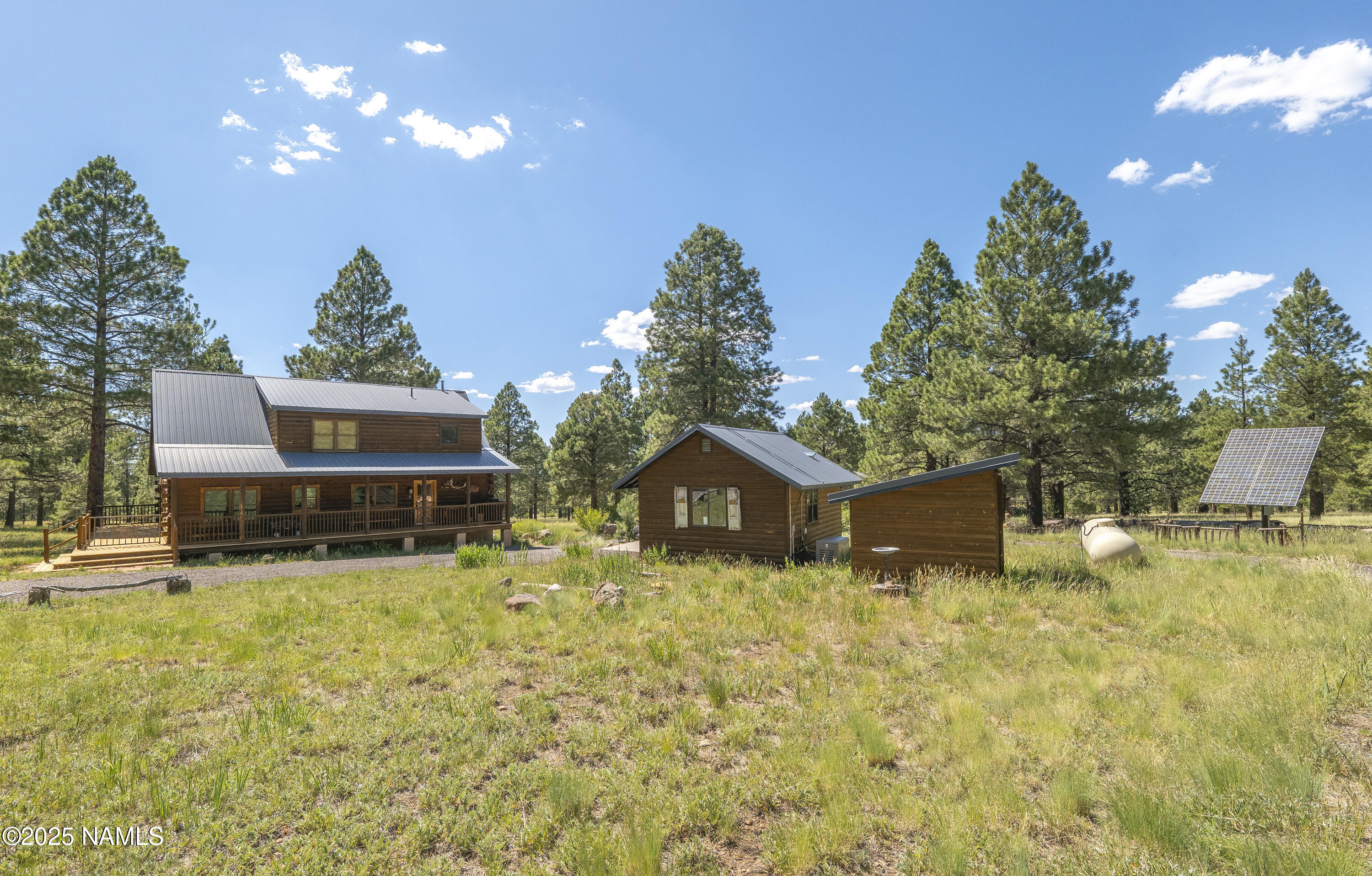 13898 Alpenglow Road Flagstaff, AZ 86001 - Photo 17 of 39 a house view with a swimming pool
