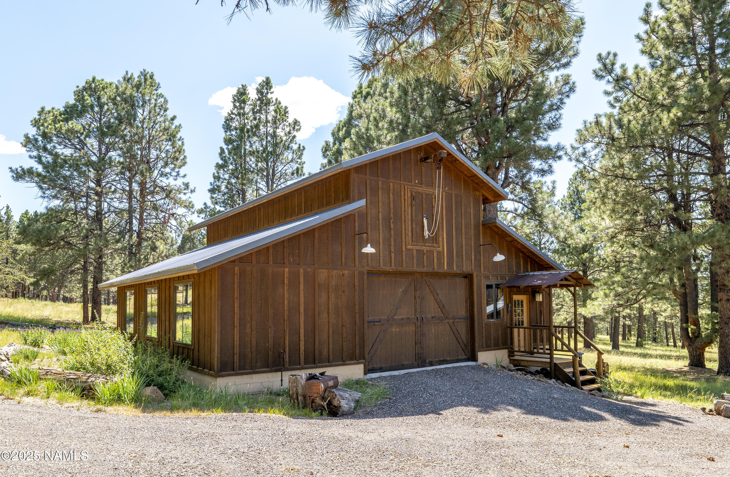 13898 Alpenglow Road Flagstaff, AZ 86001 - Photo 19 of 39 a front view of a house with a yard