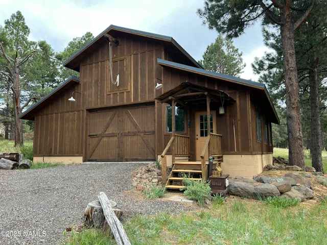 a wooden bench sitting in front of a house
