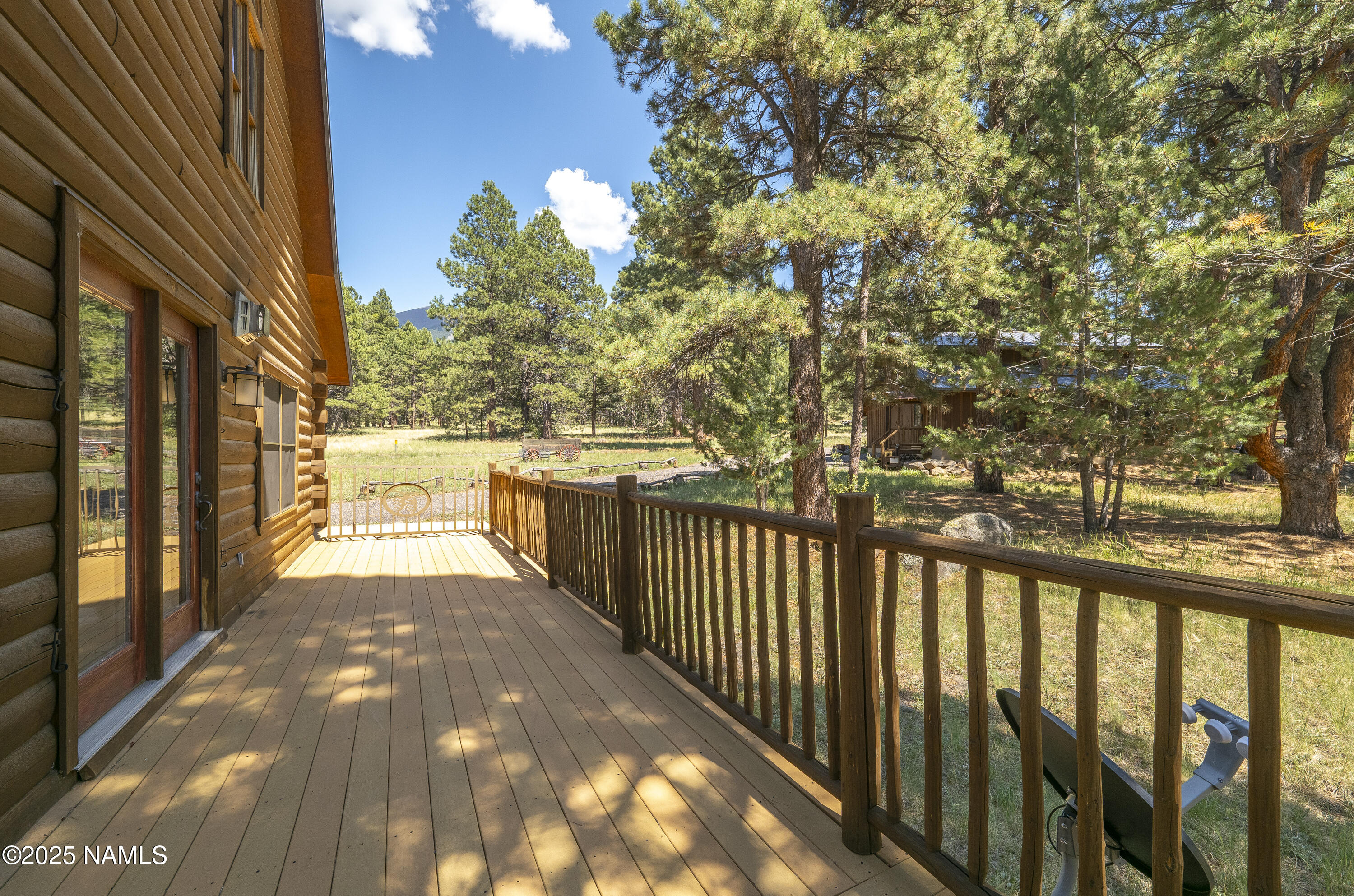 13898 Alpenglow Road Flagstaff, AZ 86001 - Photo 23 of 39 a view of a pathway with a wrought fence