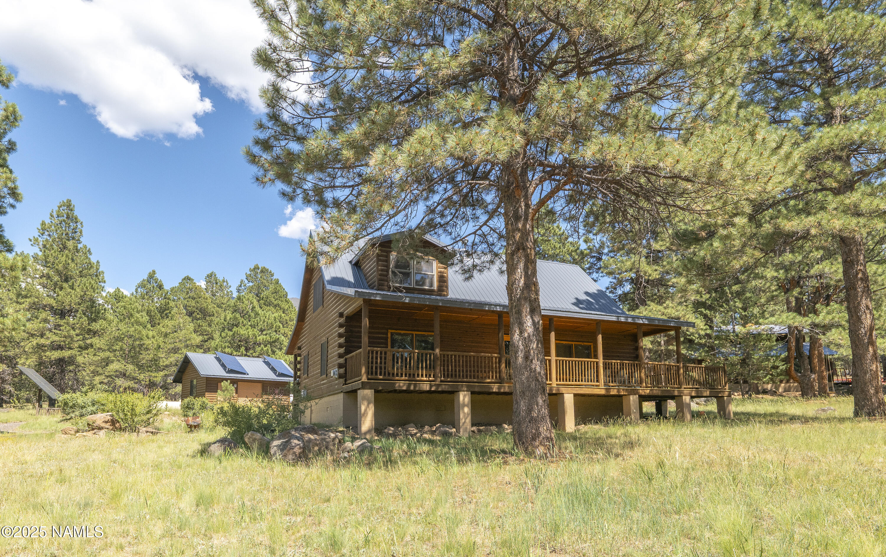 13898 Alpenglow Road Flagstaff, AZ 86001 - Photo 24 of 39 a view of a house with a yard