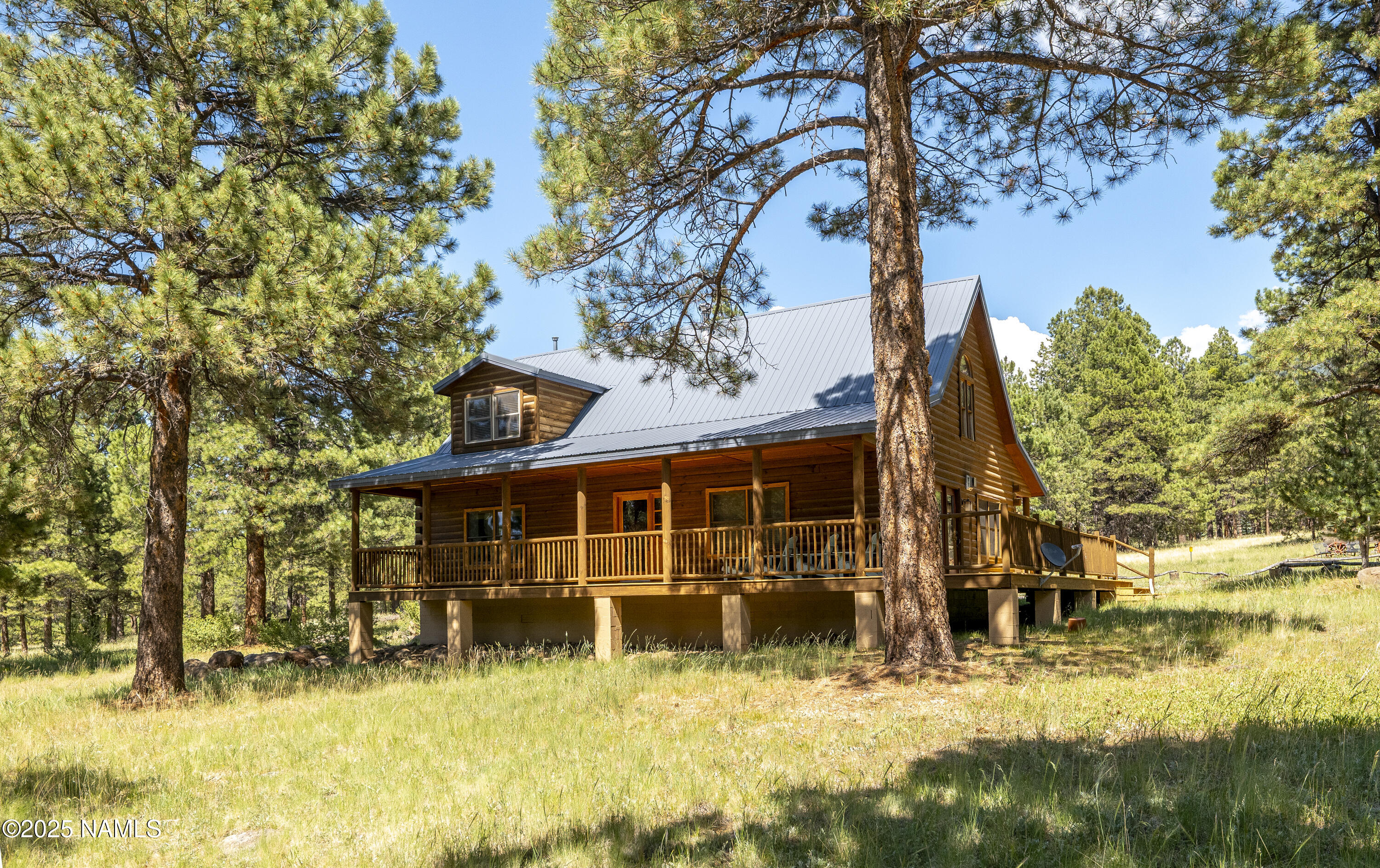 13898 Alpenglow Road Flagstaff, AZ 86001 - Photo 25 of 39 front view of a house with a yard