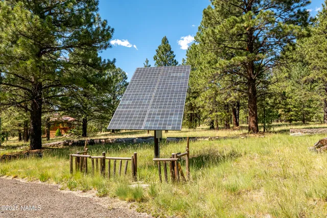 a living room with lots of furniture and a chandelier