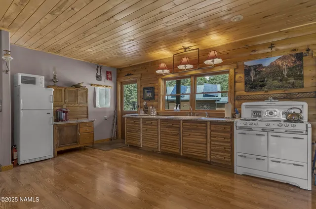 a room with lots of chairs and mirrors