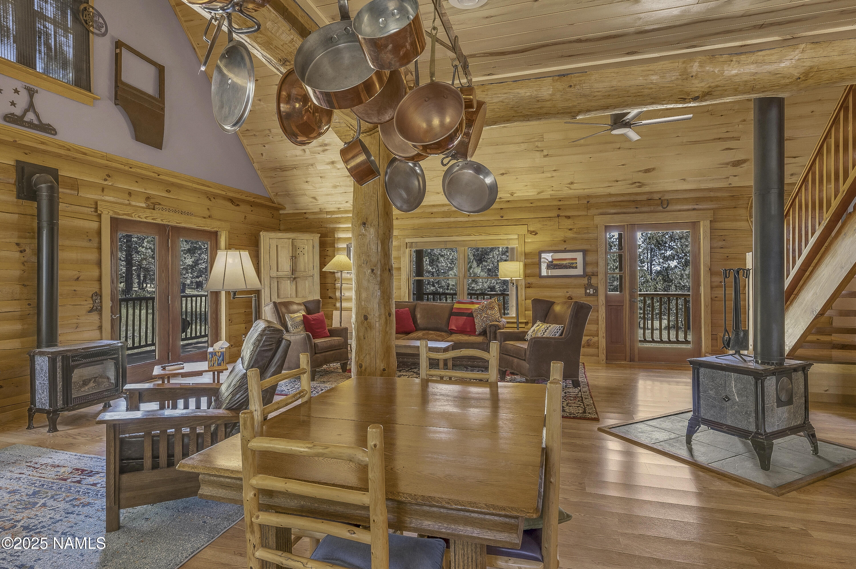 13898 Alpenglow Road Flagstaff, AZ 86001 - Photo 33 of 39 a room with lots of chairs and mirrors