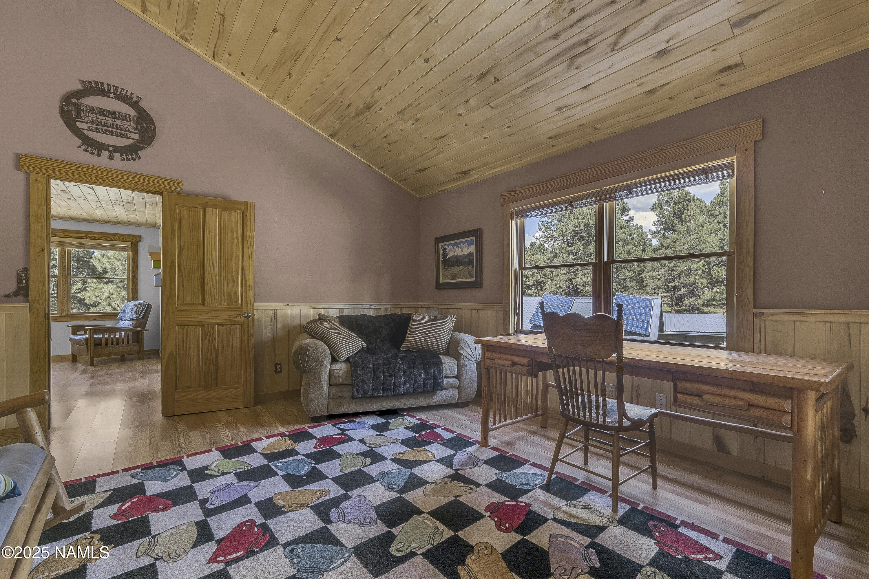 13898 Alpenglow Road Flagstaff, AZ 86001 - Photo 36 of 39 a living room with furniture and a rug