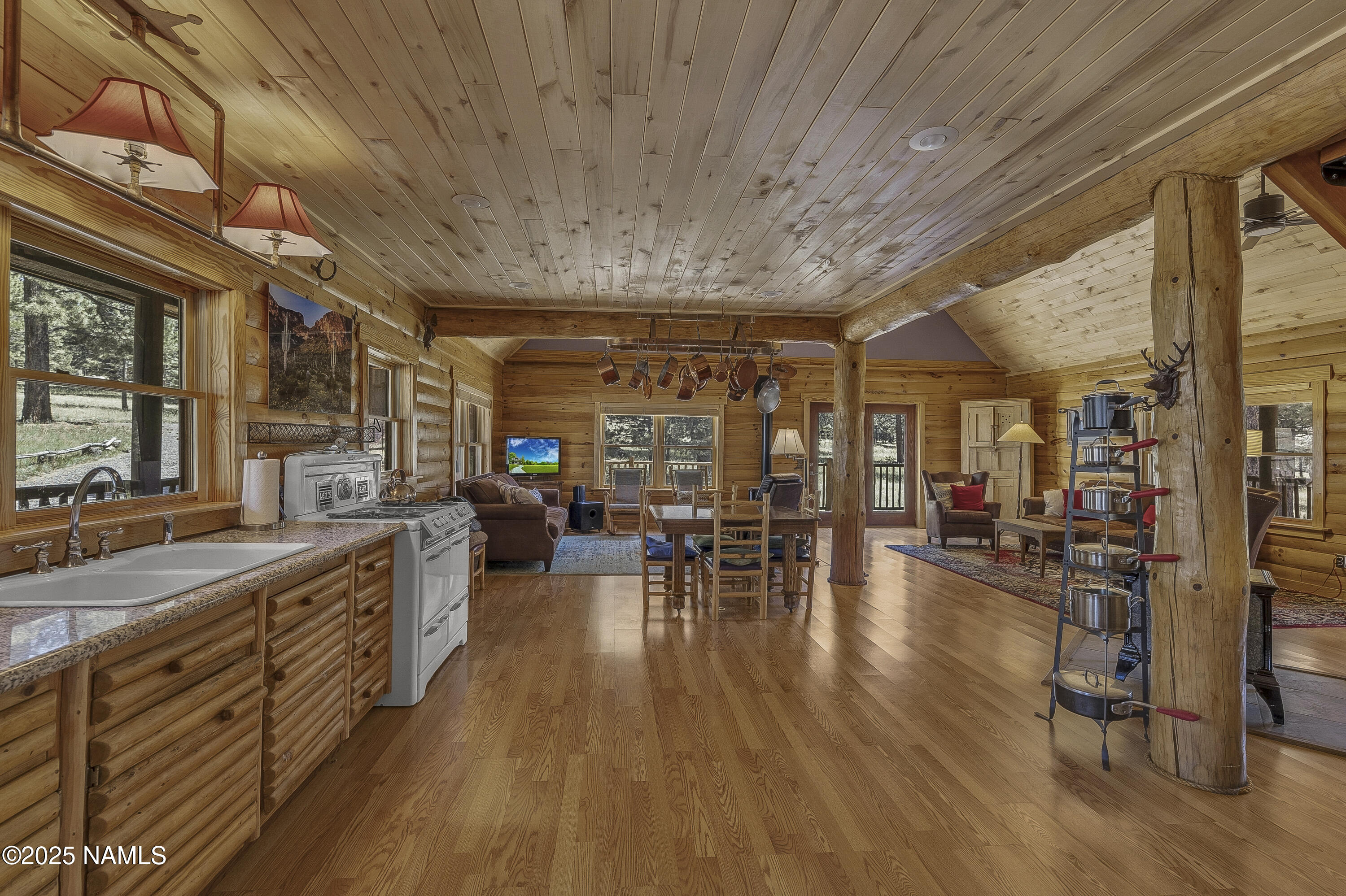 13898 Alpenglow Road Flagstaff, AZ 86001 - Photo 7 of 39 a very nice looking room with wooden floor and furniture