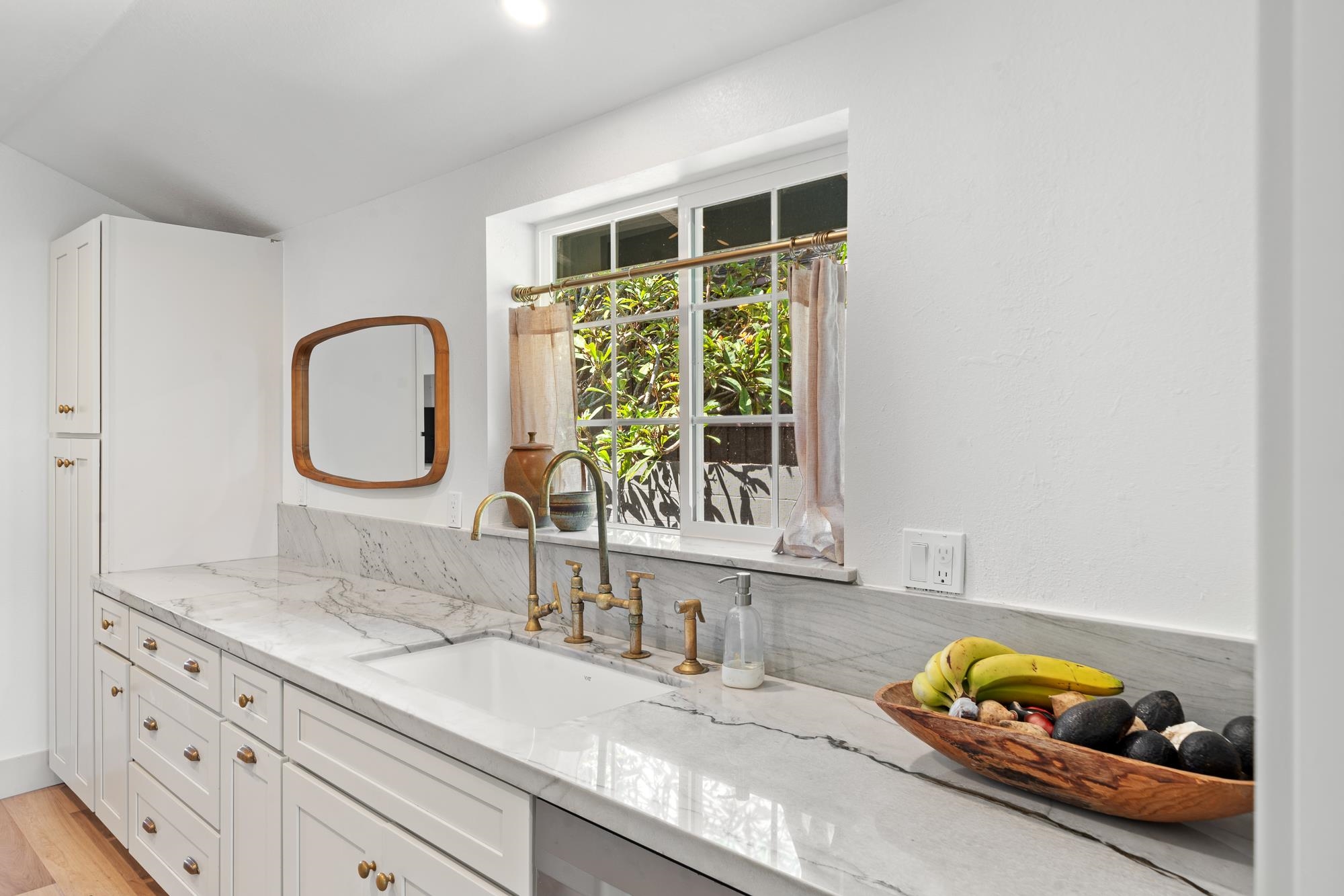 2074 Puuohala Road Wailuku, HI 96793 - Photo 11 of 37 a bathroom with a granite countertop sink and a window