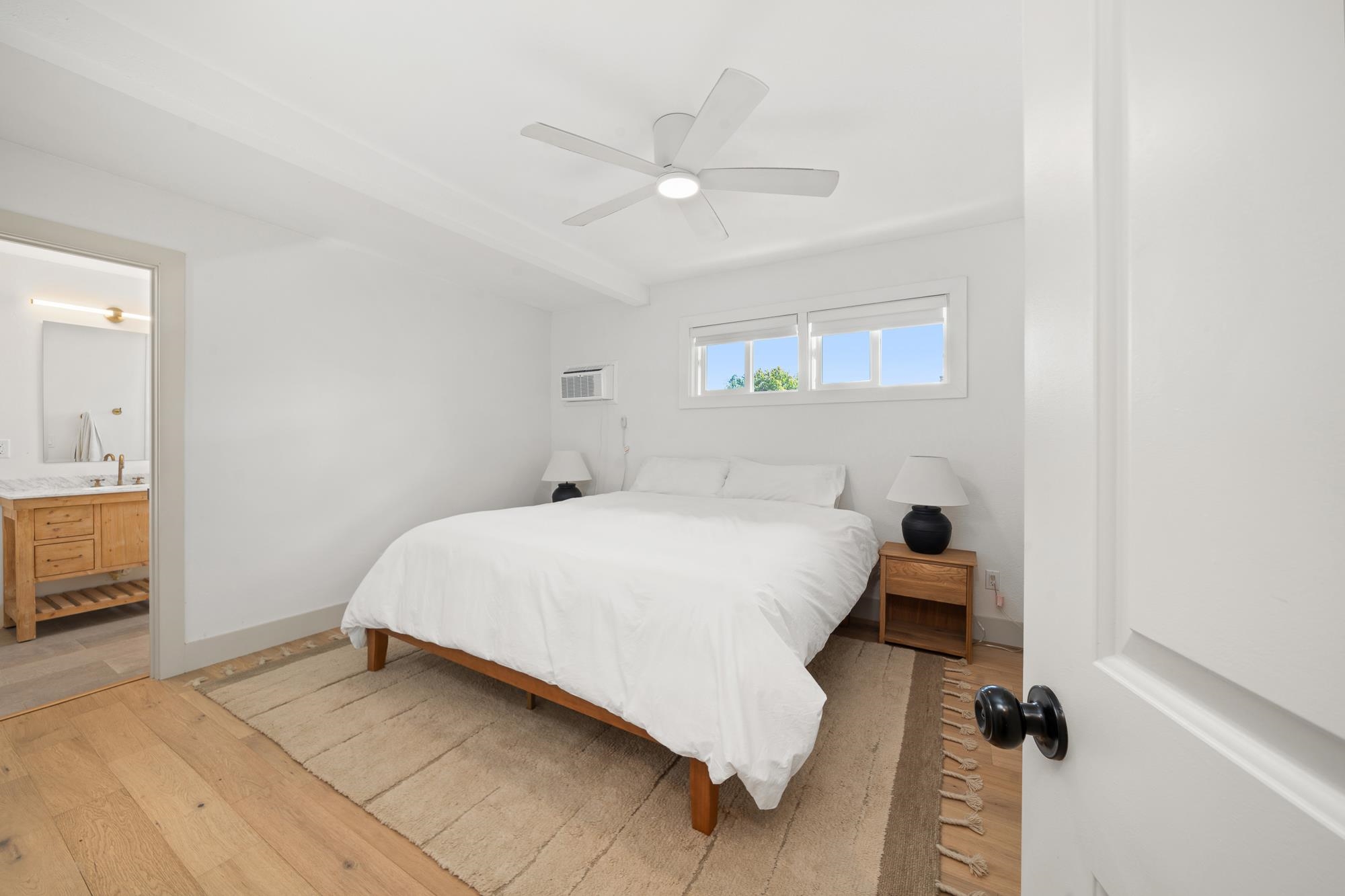 2074 Puuohala Road Wailuku, HI 96793 - Photo 12 of 37 a bed room with a bed and a ceiling fan
