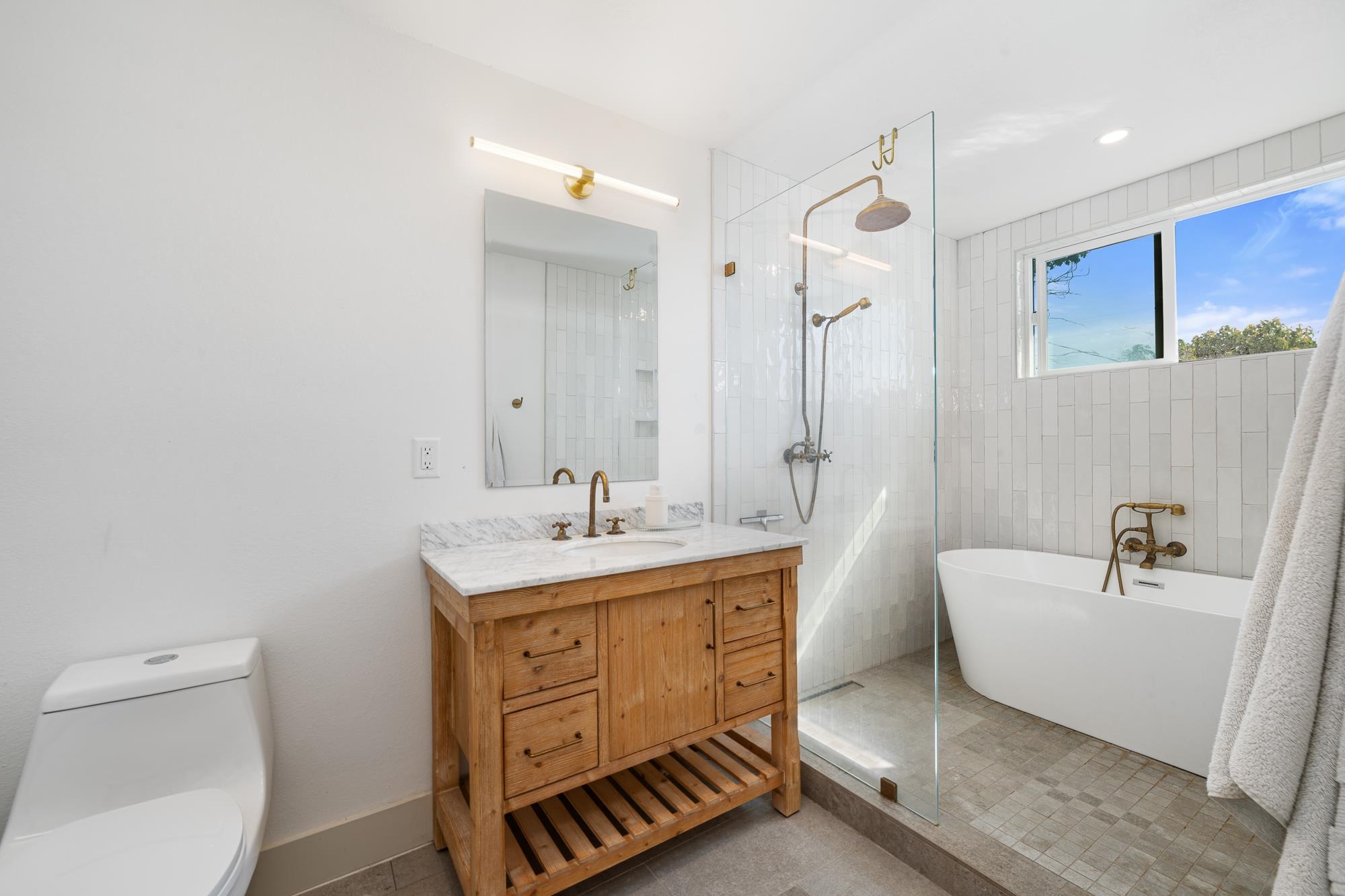 2074 Puuohala Road Wailuku, HI 96793 - Photo 14 of 37 a bathroom with a sink a toilet and shower