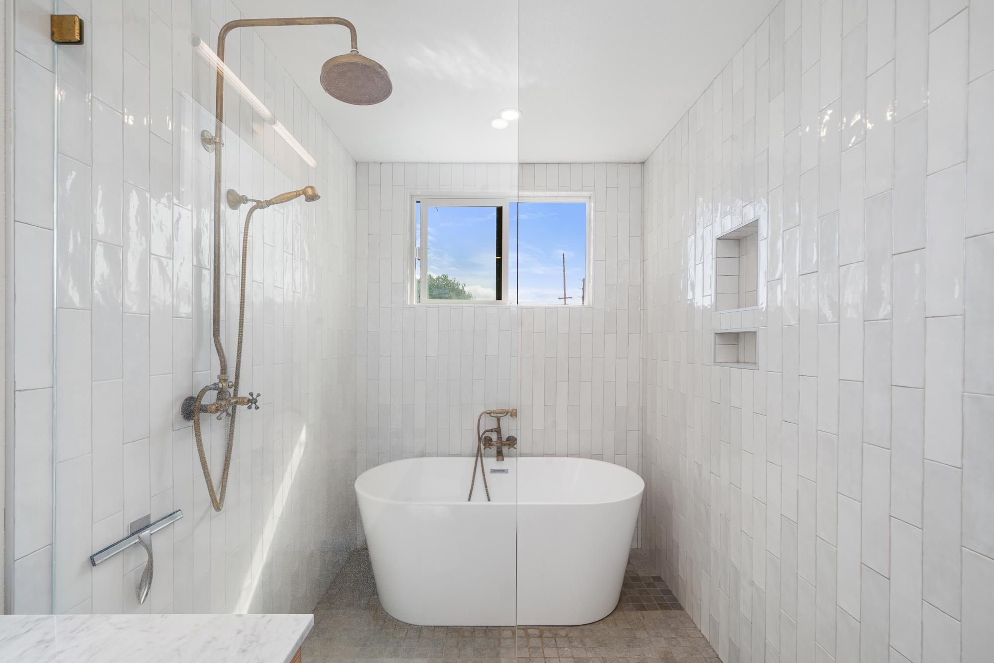 2074 Puuohala Road Wailuku, HI 96793 - Photo 15 of 37 a bathroom with a bathtub and shower