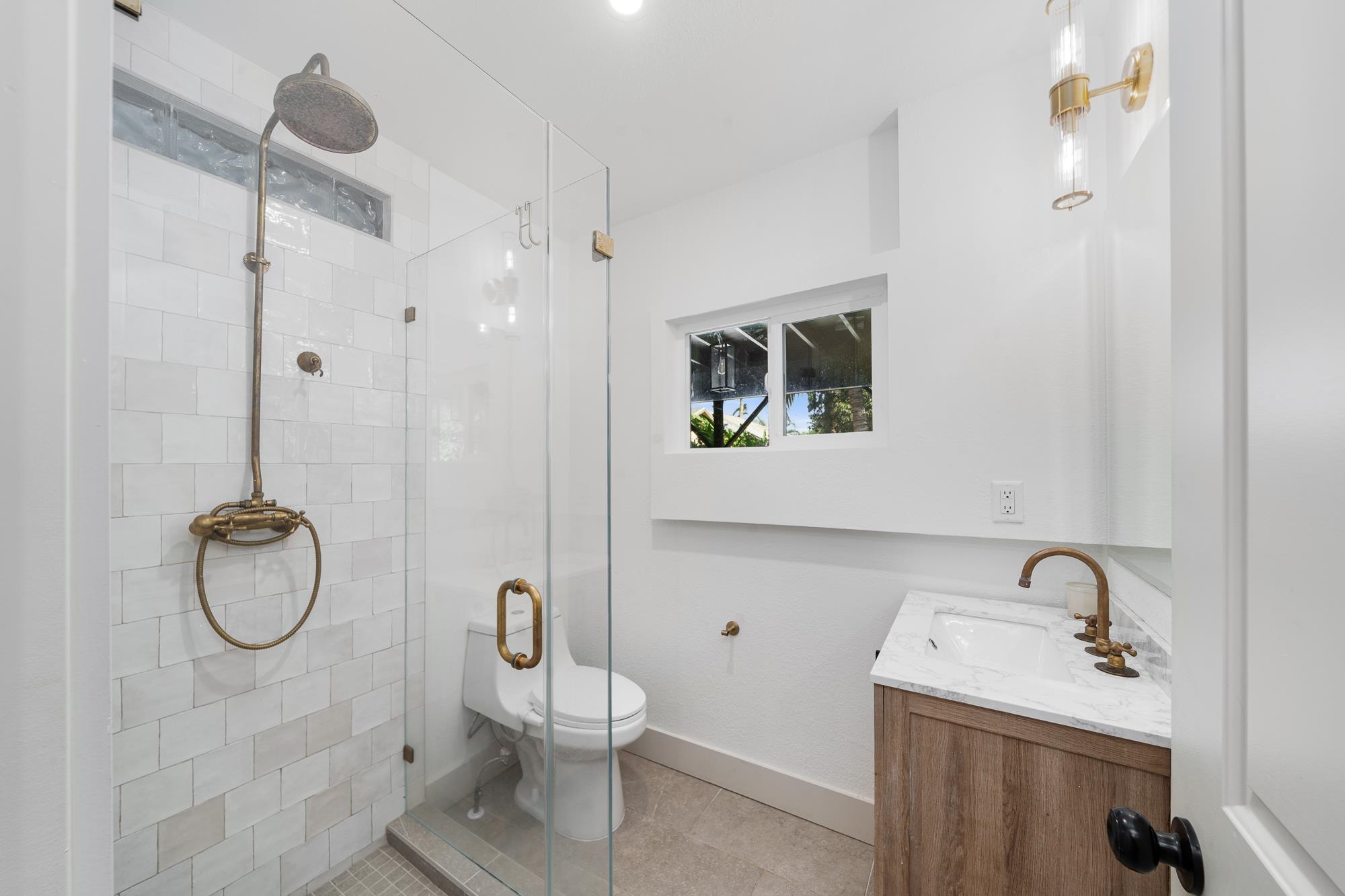 2074 Puuohala Road Wailuku, HI 96793 - Photo 22 of 37 a bathroom with a sink mirror and toilet