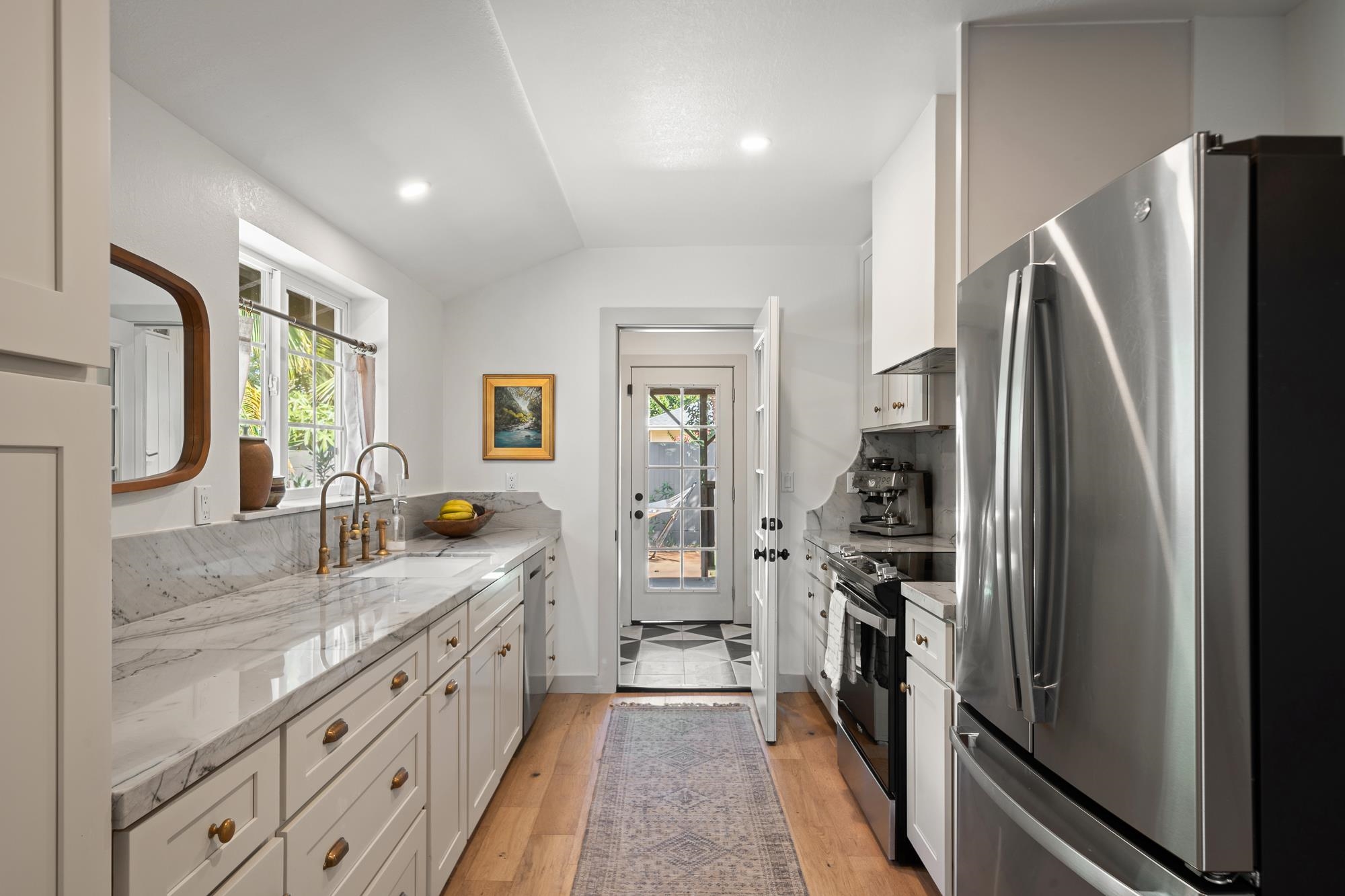 2074 Puuohala Road Wailuku, HI 96793 - Photo 6 of 37 a kitchen with stainless steel appliances granite countertop a refrigerator and a sink