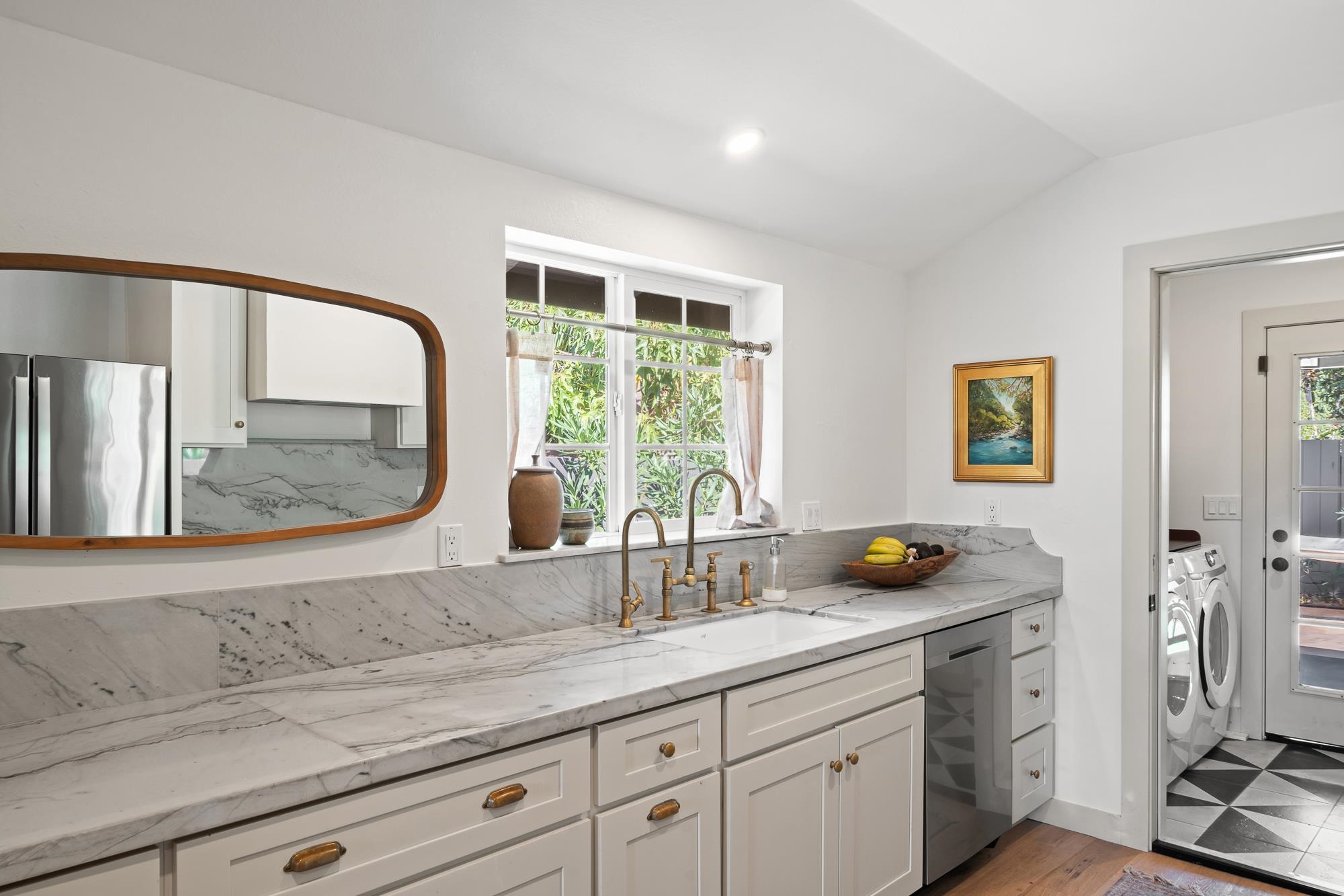 2074 Puuohala Road Wailuku, HI 96793 - Photo 8 of 37 a bathroom with a sink a mirror and a window