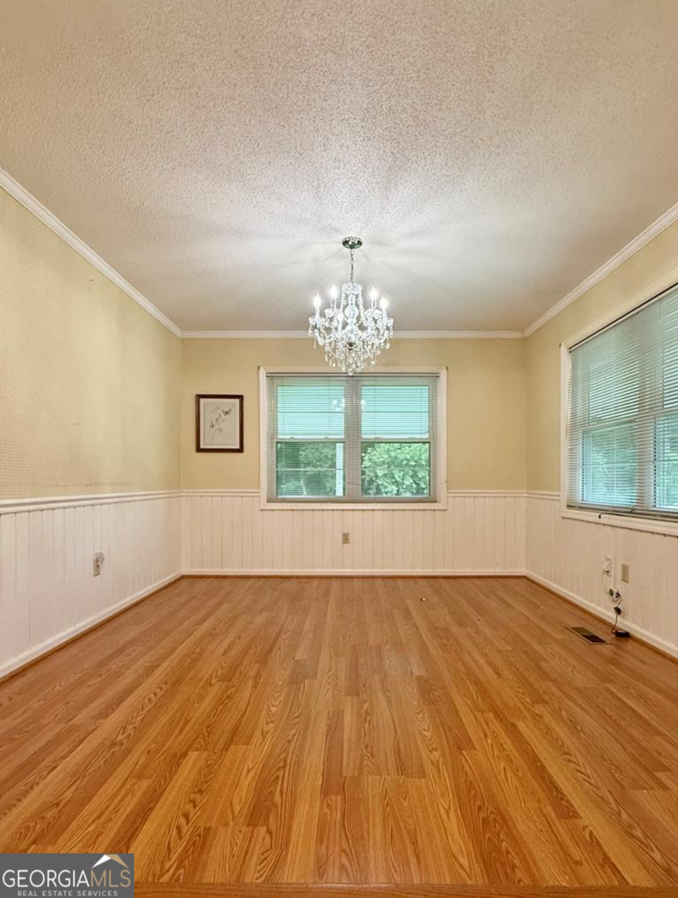 93 Arnall Boulevard Blakely, GA 39823 - Photo 13 of 43 wooden floor in an empty room with a window