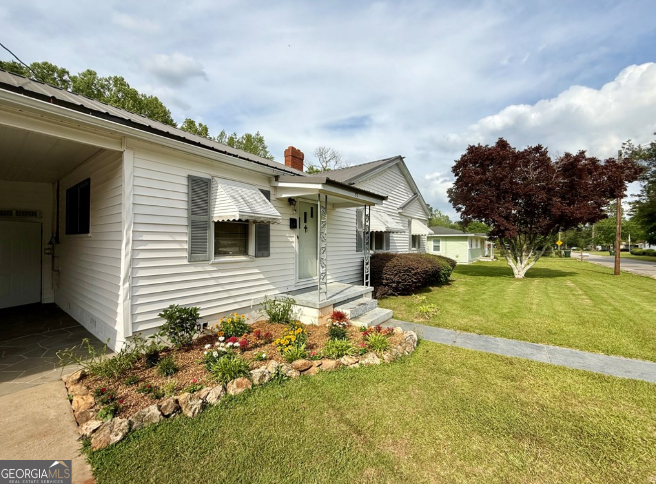 93 Arnall Boulevard Blakely, GA 39823 - Photo 2 of 43 a front view of a house with a yard