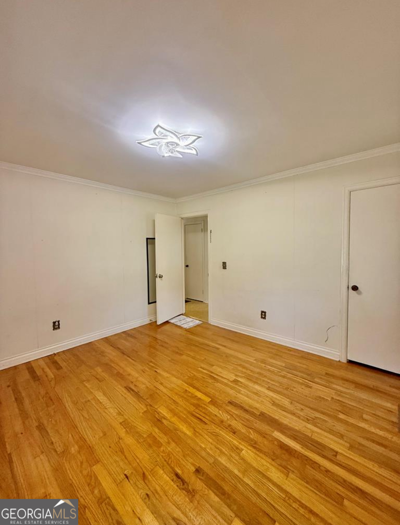 93 Arnall Boulevard Blakely, GA 39823 - Photo 32 of 43 a view of empty room with wooden floor