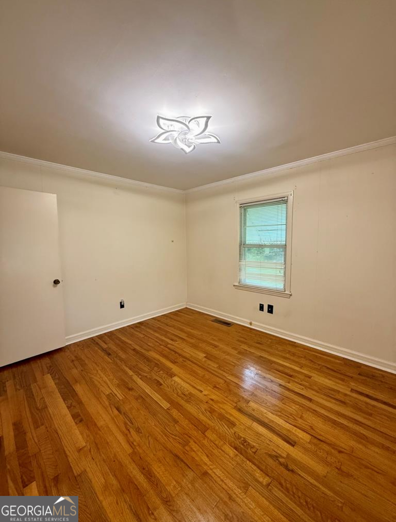 93 Arnall Boulevard Blakely, GA 39823 - Photo 33 of 43 a view of a room with wooden floor and windows