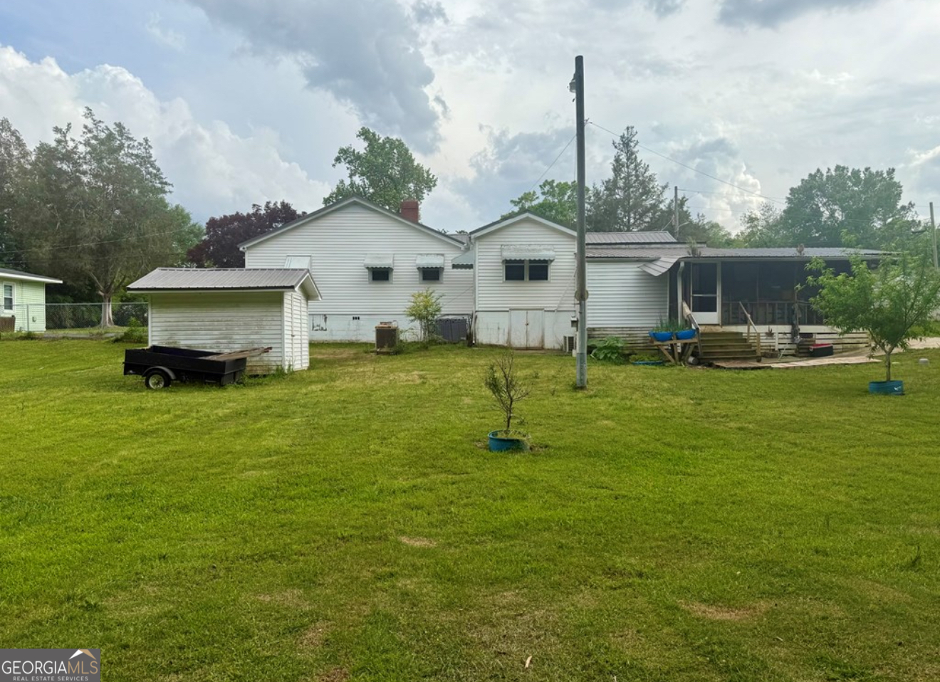 93 Arnall Boulevard Blakely, GA 39823 - Photo 38 of 43 a front view of house with yard and car parked