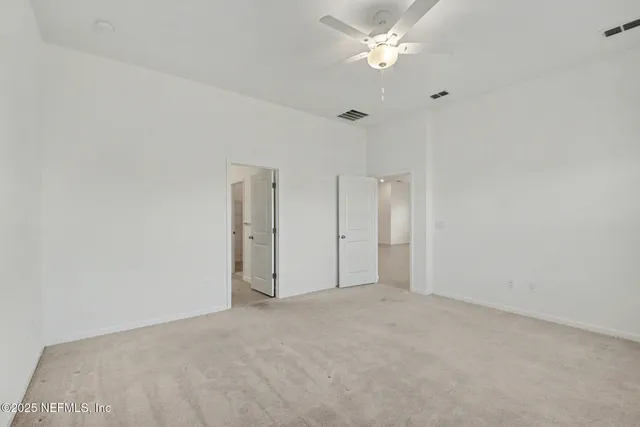 a bathroom with a toilet and a bath tub
