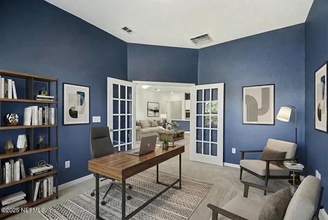 a living room with furniture a bookshelf and a bookshelf