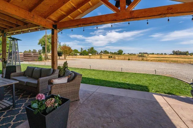 a kitchen with center island counter top space a sink and appliances