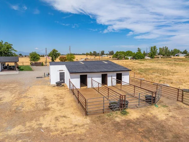 a bathroom with a sink mirror vanity and toilet