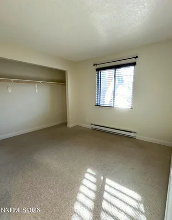an empty room with a windows