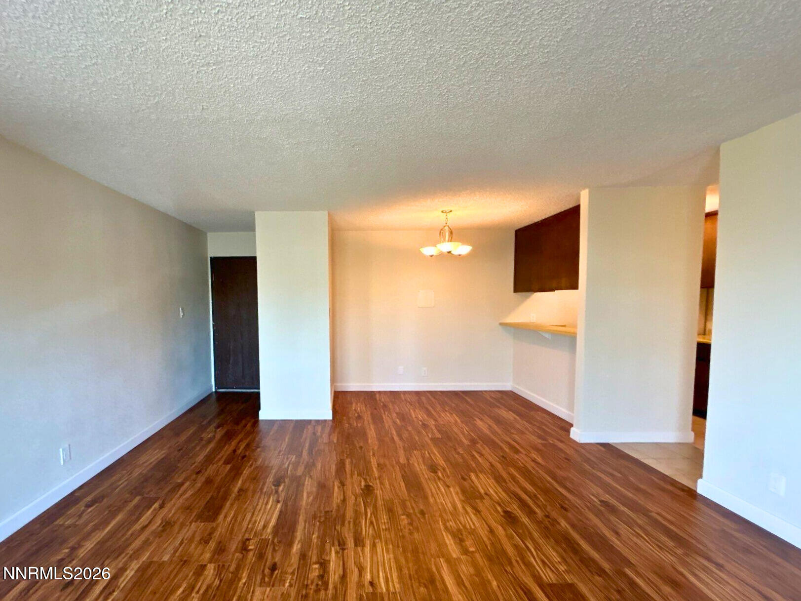 2450 Lymbery Street, Unit 305 Reno, NV 89509 - Photo 2 of 13 a view of empty room with wooden floor