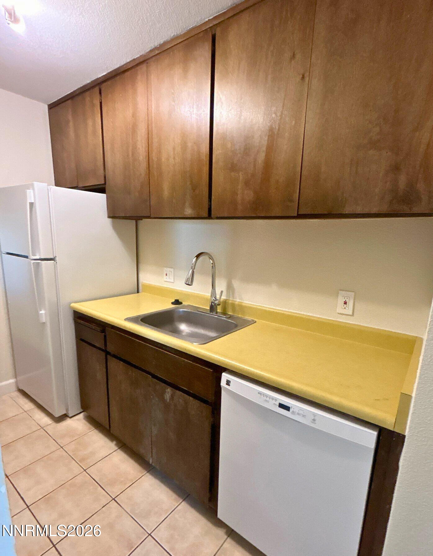 2450 Lymbery Street, Unit 305 Reno, NV 89509 - Photo 7 of 13 a kitchen with a sink and cabinets