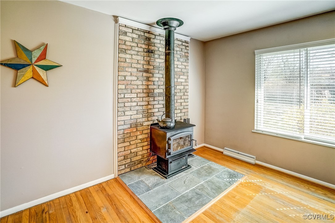 2124 Tarleton Drive Charlottesville, VA 22901 - Photo 11 of 45 a living room with blue walls with a rug