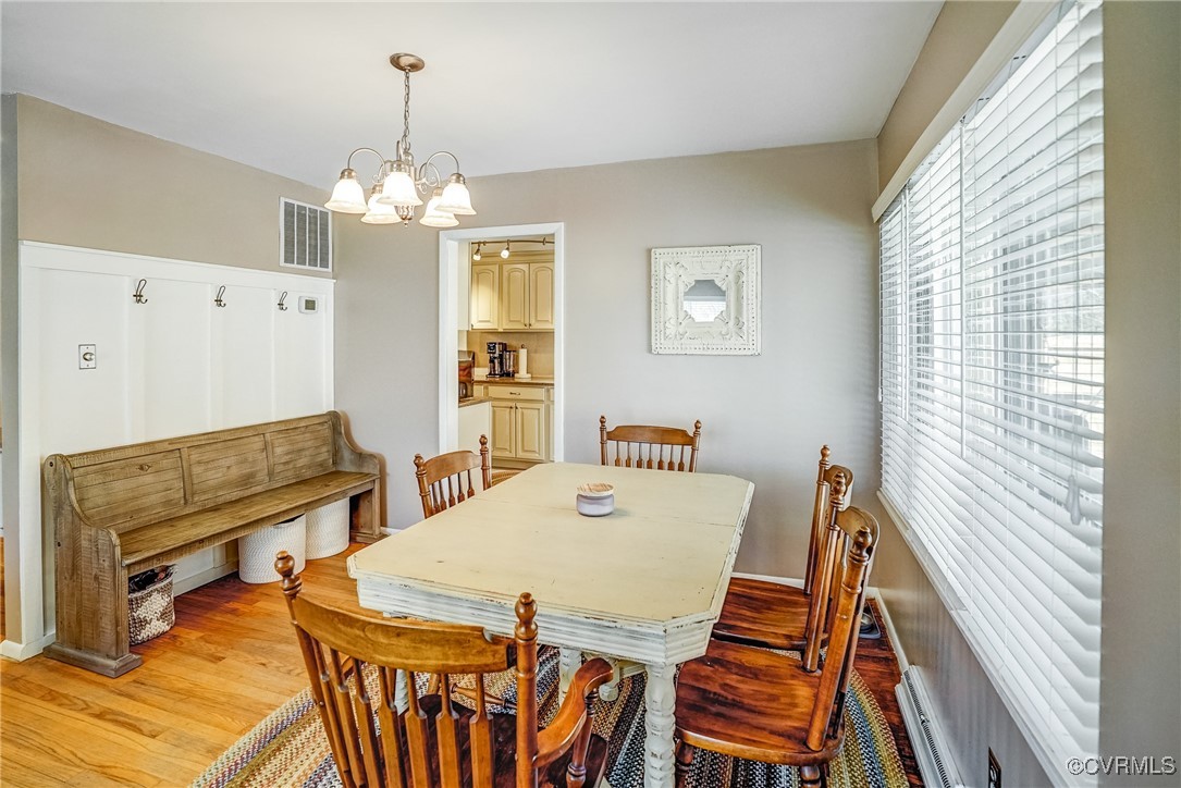 2124 Tarleton Drive Charlottesville, VA 22901 - Photo 12 of 45 a view of a dining room with furniture window and wooden floor