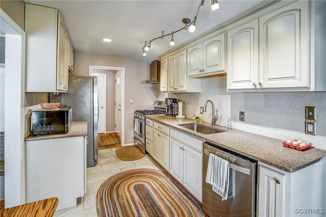 2124 Tarleton Drive Charlottesville, VA 22901 - Photo 18 of 45 a kitchen with a sink stove top oven and refrigerator