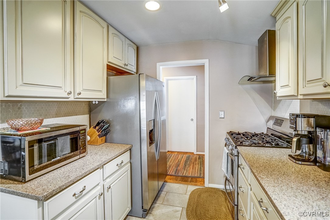 2124 Tarleton Drive Charlottesville, VA 22901 - Photo 19 of 45 a kitchen with stainless steel appliances granite countertop a sink and a refrigerator